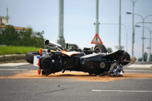 Queens Motorcycle Accident showing a fallen motorcycle in the middle of the road