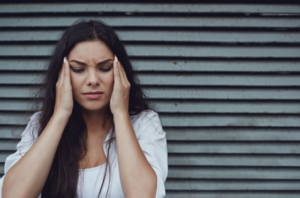 headaches are a common symptom of TBIs - brain injury lawyer queens NY